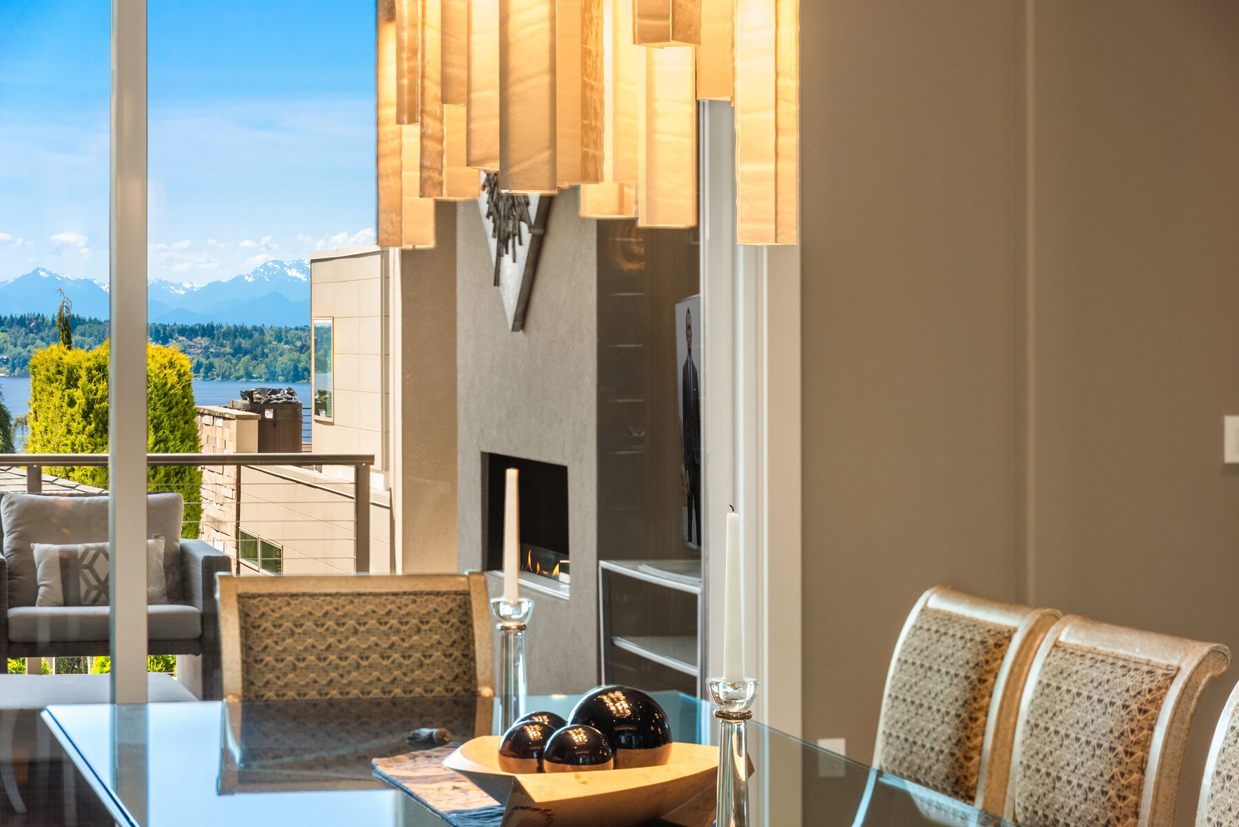 Dining area with lake and mountain views