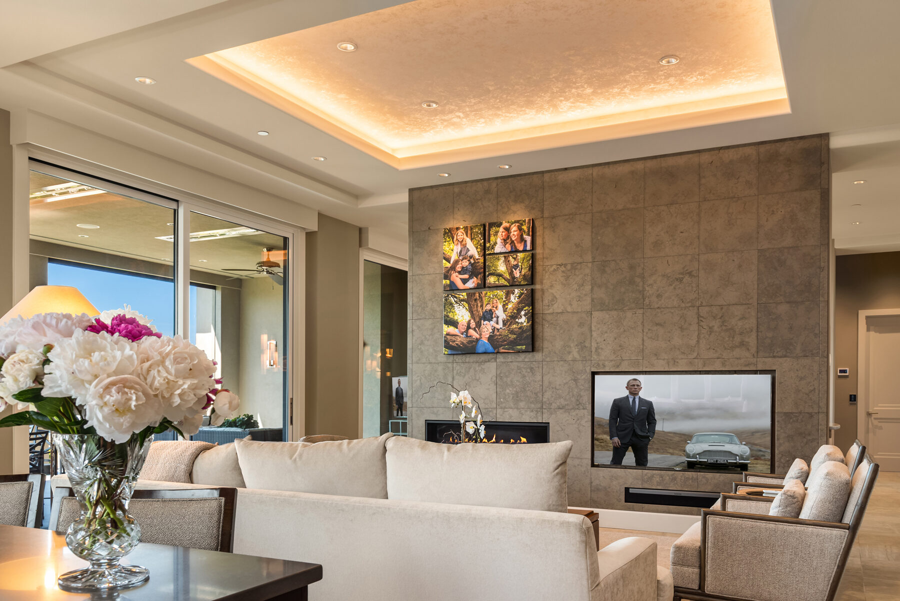 Main living area with linear fireplace and lake views